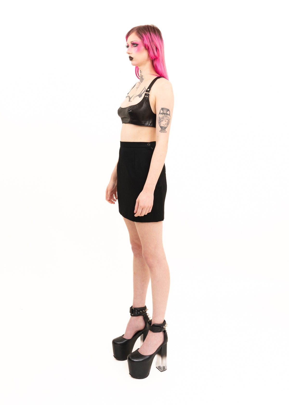 Mini skirt with lace insert and strap detail