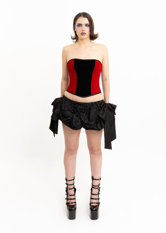 Satin ruched mini skirt with oversized bows