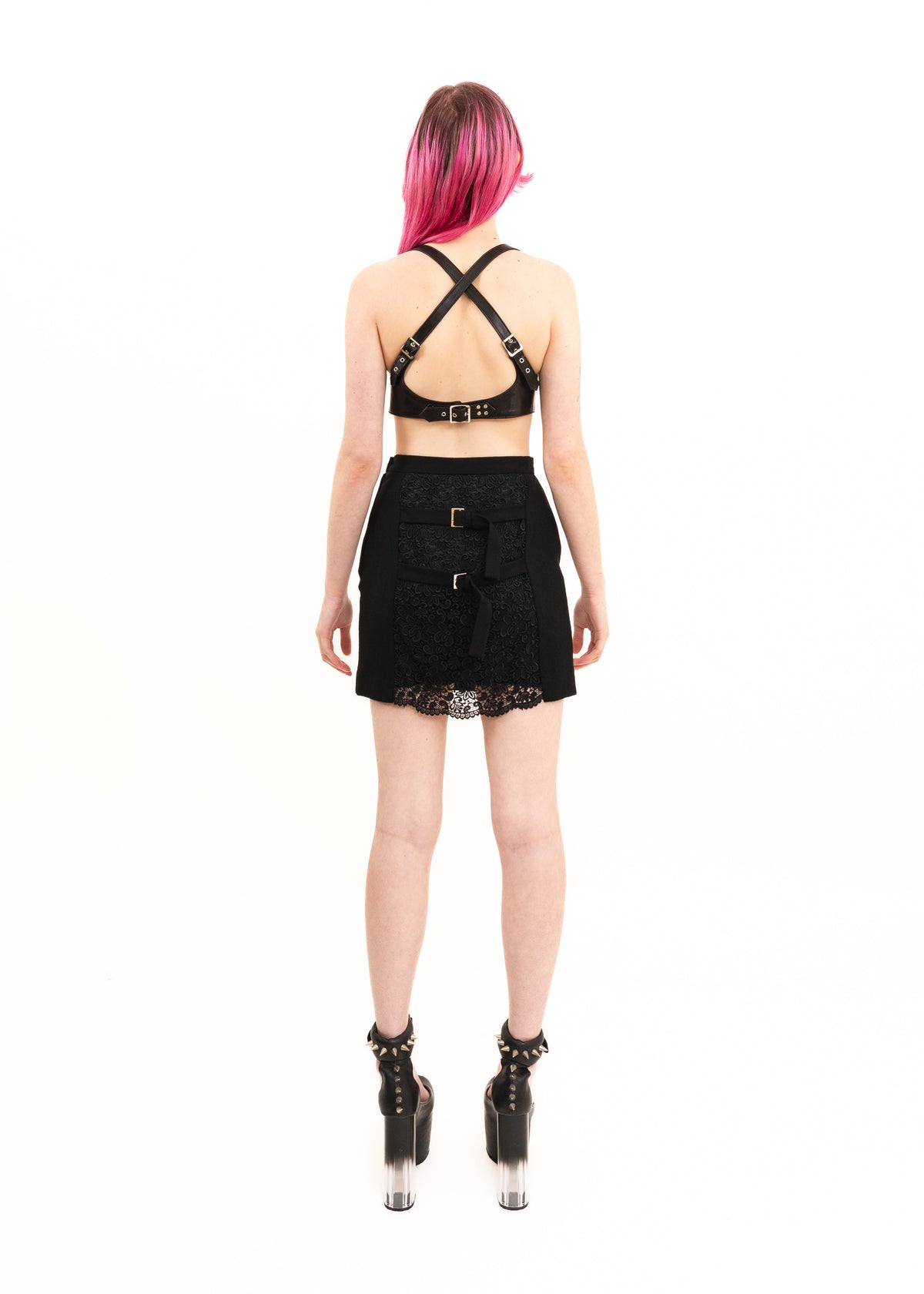 Mini skirt with lace insert and strap detail