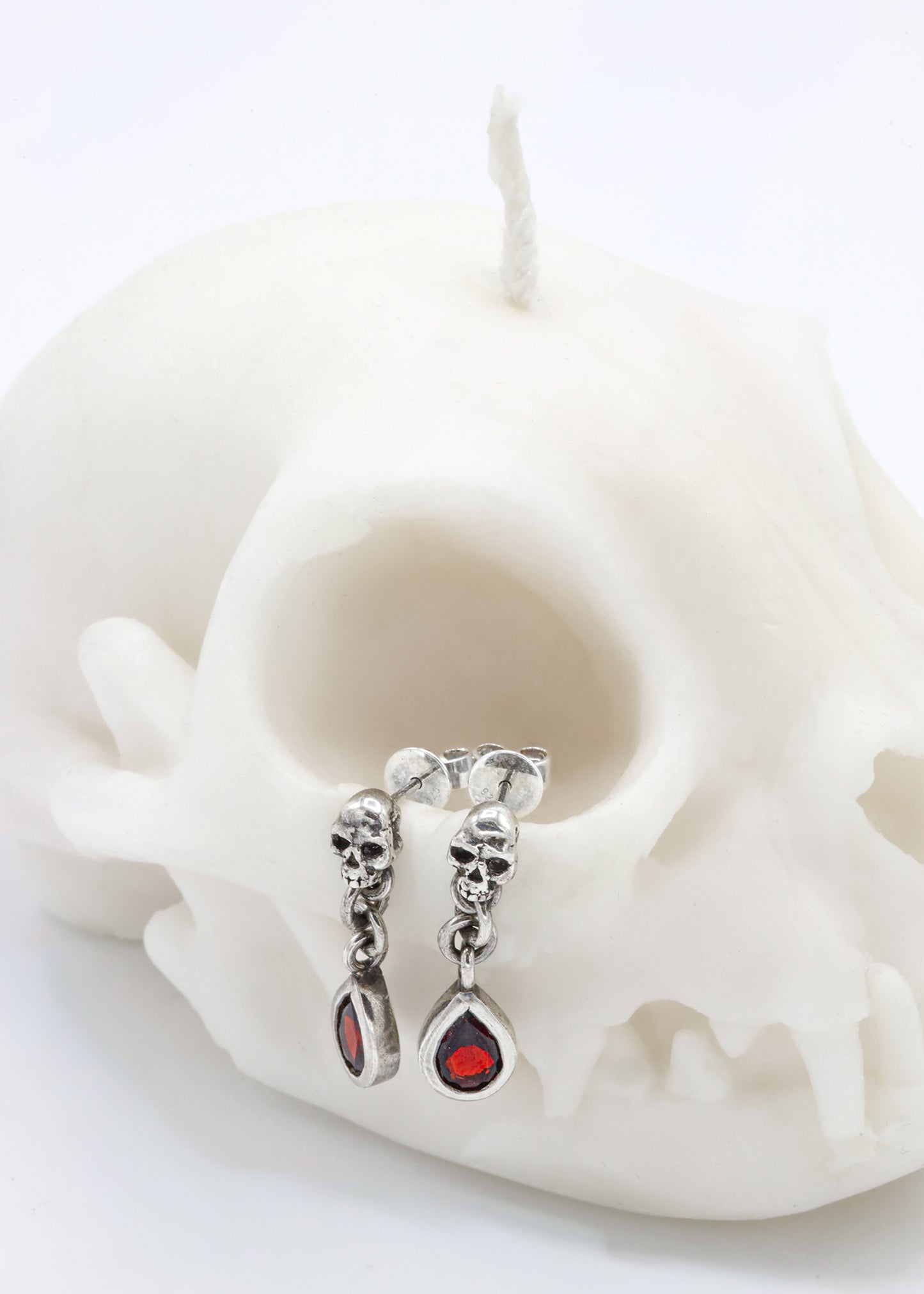 Skull garnet drop earrings